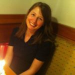 photo of a woman with medium-length hair smiling