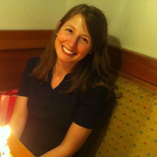 photo of a woman with medium-length hair smiling